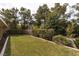 Well-maintained backyard features lush lawn and mature landscaping for privacy and serenity at 5260 Styers St, North Las Vegas, NV 89031