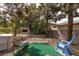 Relaxing backyard with swing and mature trees, ideal for outdoor leisure and enjoying nature at 5260 Styers St, North Las Vegas, NV 89031