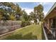 Expansive backyard features mature trees, lush lawn, and covered patio at 5260 Styers St, North Las Vegas, NV 89031
