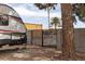 Spacious backyard with a gate and an RV providing space for parking and storage at 5260 Styers St, North Las Vegas, NV 89031