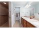 Updated bathroom featuring double sinks, granite countertops, and a walk-in shower at 5260 Styers St, North Las Vegas, NV 89031