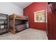 Comfortable bedroom featuring a bunk bed and bright-colored accent wall at 5260 Styers St, North Las Vegas, NV 89031