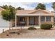 Inviting front porch with a cozy bench and decorative landscaping at 5260 Styers St, North Las Vegas, NV 89031