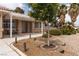 Well-manicured front yard with mature trees and a welcoming entrance at 5260 Styers St, North Las Vegas, NV 89031