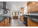 Charming kitchen with black countertops and stainless steel appliances, next to a cozy breakfast nook at 5260 Styers St, North Las Vegas, NV 89031