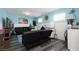 Nautical-themed living room with two sofas, decor, and accent lighting at 5260 Styers St, North Las Vegas, NV 89031