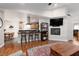 Open-concept layout featuring a fireplace, breakfast bar, and dining area at 5260 Styers St, North Las Vegas, NV 89031
