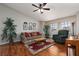 Comfortable living room with a ceiling fan and large windows at 5260 Styers St, North Las Vegas, NV 89031