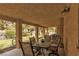 Spacious covered patio area with outdoor dining set and backyard views at 5260 Styers St, North Las Vegas, NV 89031