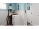 Nautical-themed powder room with accent mirror, shelving, and white paneled walls at 5260 Styers St, North Las Vegas, NV 89031