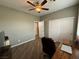 This bedroom features a ceiling fan, a desk, and large closet at 5318 Rio Eldorado Ct, North Las Vegas, NV 89031