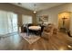 Dining area with a chandelier and sliding glass doors leading to the backyard at 5318 Rio Eldorado Ct, North Las Vegas, NV 89031
