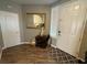 Inviting entryway featuring a stylish mirror, tile rug, and wood-look flooring at 5318 Rio Eldorado Ct, North Las Vegas, NV 89031