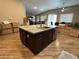 Kitchen island with seating, surrounded by moving boxes and an open floorplan at 5318 Rio Eldorado Ct, North Las Vegas, NV 89031