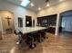 Open-concept kitchen featuring an island with seating, updated appliances, and a skylight at 5318 Rio Eldorado Ct, North Las Vegas, NV 89031