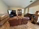 Living room with wood-look flooring, furniture, and natural light from the windows at 5318 Rio Eldorado Ct, North Las Vegas, NV 89031