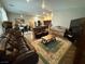 Open-concept living space with wood-look flooring and views into the kitchen and dining area at 5318 Rio Eldorado Ct, North Las Vegas, NV 89031