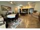 Open-concept living space with wood-look flooring, a dining area, and a kitchen at 5318 Rio Eldorado Ct, North Las Vegas, NV 89031