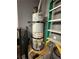 A.O. Smith water heater with attached yellow gas line sitting in a gray utility room at 5318 Rio Eldorado Ct, North Las Vegas, NV 89031