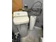 Water softener and filter equipment, featuring digital display, and metallic connections in gray utility room at 5318 Rio Eldorado Ct, North Las Vegas, NV 89031