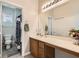Bright bathroom showcasing a vanity with ample counter space, a toilet room, and closet at 5409 Cruz Crest Ct, North Las Vegas, NV 89081