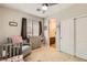 Charming bedroom with chair, crib, changing table, ceiling fan, and sliding-door closet at 5409 Cruz Crest Ct, North Las Vegas, NV 89081