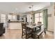 Stylish kitchen with granite countertops, stainless steel appliances, dining area, and ample natural light at 5409 Cruz Crest Ct, North Las Vegas, NV 89081