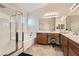 Bright main bathroom with double sinks, vanity area, glass shower and separate tub at 5409 Cruz Crest Ct, North Las Vegas, NV 89081