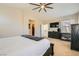 Cozy main bedroom featuring a ceiling fan, neutral decor, and a view of the walk-in closet at 5409 Cruz Crest Ct, North Las Vegas, NV 89081
