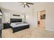 Comfortable main bedroom featuring a ceiling fan, neutral walls, and ensuite bathroom at 5409 Cruz Crest Ct, North Las Vegas, NV 89081