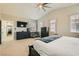 Large main bedroom featuring neutral decor, a ceiling fan, and a view of the walk-in closet at 5409 Cruz Crest Ct, North Las Vegas, NV 89081