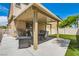 Outdoor patio area complete with a grill, dining table, and well-manicured artificial grass at 5409 Cruz Crest Ct, North Las Vegas, NV 89081
