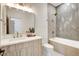 Bathroom with a modern single vanity and shower-tub combination at 5737 Heather Breeze Ct, Las Vegas, NV 89141