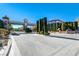 View of the decorative gated entrance to the Aberdeen community with manicured landscaping and clear blue sky at 5737 Heather Breeze Ct, Las Vegas, NV 89141