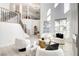 Spacious living room with staircase and ample natural light at 5737 Heather Breeze Ct, Las Vegas, NV 89141