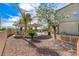 Extensive backyard features an outdoor kitchen, swimming pool, mature trees and greenery, perfect for outdoor living at 5949 Casa Coronado Ave, Las Vegas, NV 89131