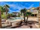 Backyard with a pool, spa, covered patio, and lush landscaping. Ready for entertaining! at 5949 Casa Coronado Ave, Las Vegas, NV 89131