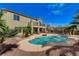 Beautiful two-story home featuring a backyard pool, spa, covered patio, and lush landscaping at 5949 Casa Coronado Ave, Las Vegas, NV 89131