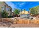 Spacious backyard includes a greenhouse, garden area, mature trees and privacy fence, creating a serene outdoor setting at 5949 Casa Coronado Ave, Las Vegas, NV 89131