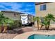 Backyard with palms, pool, and RV, ideal for outdoor living and accommodating recreational vehicles at 5949 Casa Coronado Ave, Las Vegas, NV 89131