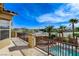 Balcony overlooking the pool area, showcasing city and mountain views with blue skies at 5949 Casa Coronado Ave, Las Vegas, NV 89131