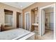 Bright bathroom featuring a large soaking tub, vanity, and walk-in closet with ample storage space at 5949 Casa Coronado Ave, Las Vegas, NV 89131