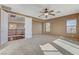 Bedroom with a ceiling fan, neutral carpet, and direct access to the loft area at 5949 Casa Coronado Ave, Las Vegas, NV 89131