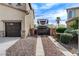 Wide driveway and parking area with an RV gate, and lush landscaping offering convenience and curb appeal at 5949 Casa Coronado Ave, Las Vegas, NV 89131