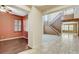 Inviting entryway features hardwood floors, staircase, with neutral color palette throughout, offering a warm welcome at 5949 Casa Coronado Ave, Las Vegas, NV 89131