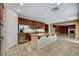 Open kitchen features granite counters, stainless appliances, large central island, and easy access to the living room at 5949 Casa Coronado Ave, Las Vegas, NV 89131