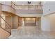 Large living room with soaring ceilings, tile flooring, a staircase, and upper level overlook at 5949 Casa Coronado Ave, Las Vegas, NV 89131