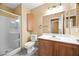 Cozy bathroom features a shower, toilet, vanity, and a cabinet for storage at 6088 Gulf Island Ave, Las Vegas, NV 89156