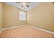 Bedroom with wood-look floors, a ceiling fan and a window with blinds at 6088 Gulf Island Ave, Las Vegas, NV 89156