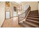 Bright foyer featuring hardwood floors, staircase, and ample natural light from the windows at 6088 Gulf Island Ave, Las Vegas, NV 89156